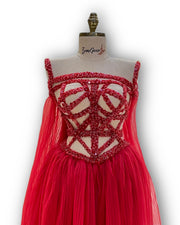 A vibrant fuchsia, sleeveless party dress with a playful skirt, ideal for a night out with friends.